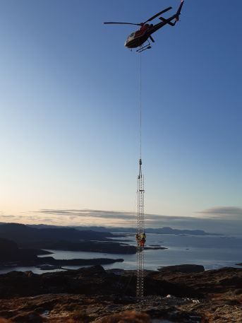 A beautiful day for mast erection.